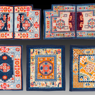 Two Tibetan saddle rugs and three small rugs, 19th C.