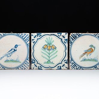 Three polychrome Dutch Delft 'flower' and 'bird' tiles, 17th C.