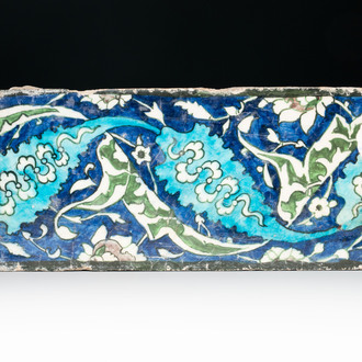 A polychrome Damascus pottery border tile with floral design, 17th C.