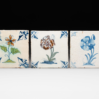 Two polychrome and one blue and white Dutch Delft 'flower' tiles, 17th C.