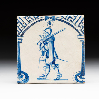 A fine blue and white Dutch Delft 'soldier' 'gate' tile, 17th C.