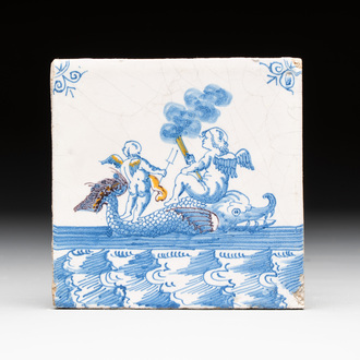 A fine partly polychrome, blue and white Dutch Delft 'sea creature with putti' tile, early 18th C.