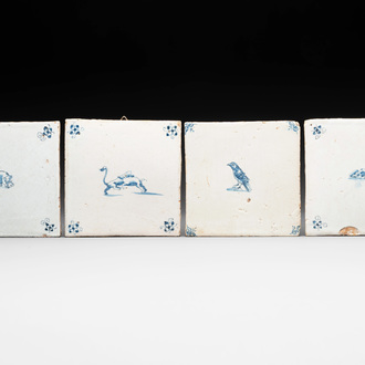 Four blue and white Dutch Delft tiles with an elephant, bird, mouse and boars, 17th C.