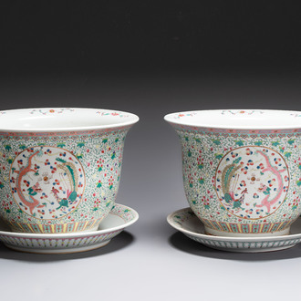A pair of large Chinese famille rose 'dragon and phoenix' jardinières and stands, 20th C.