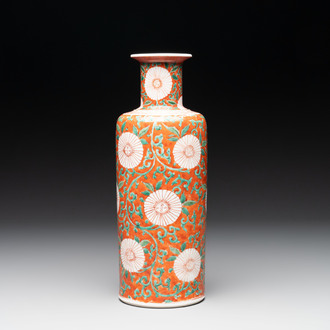 A Chinese famille verte coral-red-ground rouleau vase with flower scrolls, Kangxi