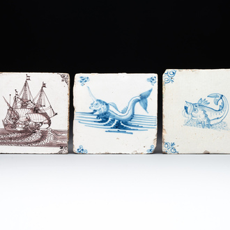 Two blue and white Dutch Delft 'sea monster' tiles and a manganese 'ship' tile, 17/18th C.