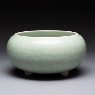 A Chinese celadon-glazed tripod censer with 'anhua' floral design, Kangxi