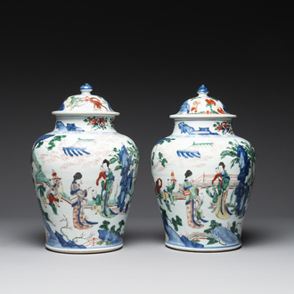 A pair of Chinese wucai vases and covers with court ladies and playing boys, Transitional period