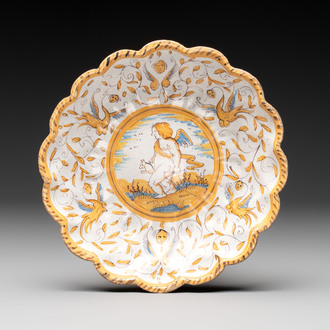 A polychrome Dutch maiolica 'putto and dog' plate, Verstraeten workshop, Haarlem, 17th C.