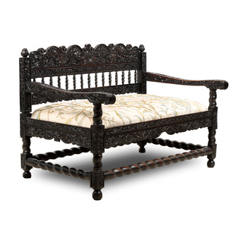 A Dutch colonial carved and ebonized wooden bench, 18th C.