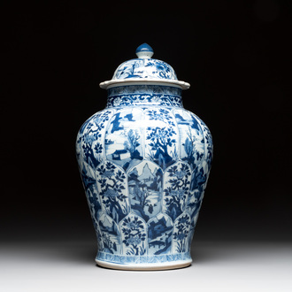A Chinese blue and white vase and cover with landscapes and flowers, Kangxi