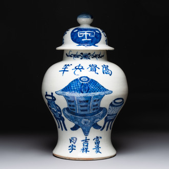 A Chinese blue and white vase and cover with calligraphy and antiquities, 19th C.