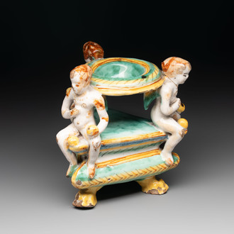 An Italian maiolica triangular salt with winged cherubs, Deruta, 17th C.