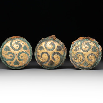 Three Chinese gilt-bronze ornaments with 'thunder' design, Han