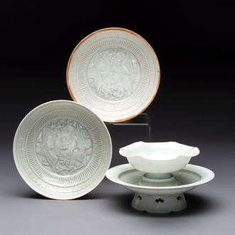 A pair of Chinese qingbai 'crane' plates and a tea bowl with stand, Song/Yuan