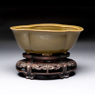 A fine Chinese teadust-glazed quadrifoil jardinière with an openworked wooden stand, Yongzheng mark and of the period