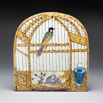 A polychrome Dutch Delft 'bird cage' plaque, 18th C.