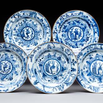 Five Chinese blue and white plates with raised central medallions, Kangxi/Yongzheng