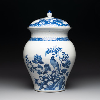 A Chinese blue and white 'birds among flowering branches' vase and cover, 19th C.