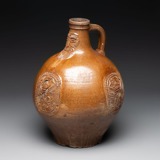 A large brown-glazed stoneware bellarmine jug, 17th C.