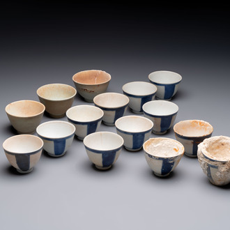 Thirteen Chinese blue and white 'Hatcher Cargo' cups and three celadon-glazed cups, Transitional period