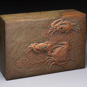 Alfred Daguet (Paris, 1875-1942): An Art Nouveau repoussé brass- and copper-mounted box with 'crabs' design and inset glass eyes, ca. 1900