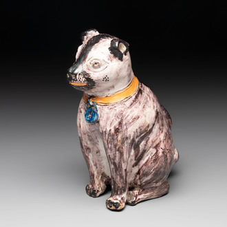 A polychrome Brussels faience model of a dog, 18th C.