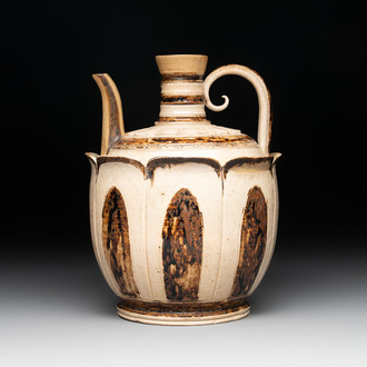 An Annamese or Vietnamese brown-glazed cream-ground 'lotus' ewer, 14th C.