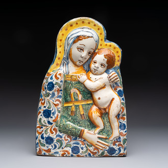 A polychrome molded Italian maiolica 'Madonna and Child' plaque, 17th C.