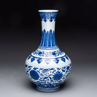 A Chinese blue and white 'flower scroll' bottle vase, Xuantong mark, 20th C.