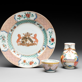 A Chinese famille rose armorial plate, a cup and a 'European subject' milk jug, Yongzheng/Qianlong
