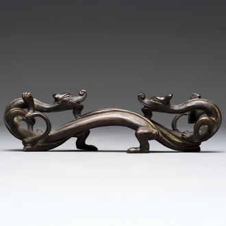 A Chinese bronze 'dragon' brush rest, Song/Yuan