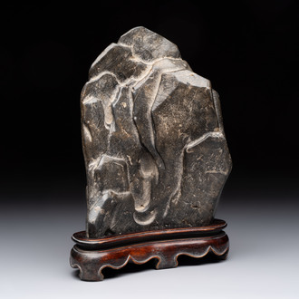 A Chinese Lingbi stone scholar's rock on wooden stand, Yun Tai 雲台 mark, 19/20th C.