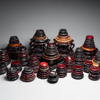 A collection of 100 Chinese wooden stands, 19/20th C.