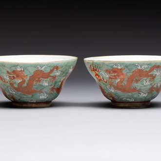 A pair of Chinese gilt and iron-red decorated 'dragons on waves' bowls, Jiaqing mark, 19th C.