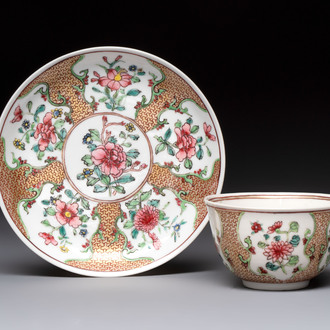 A fine Chinese gilt-decorated famille rose cup and saucer with floral design, Yongzheng