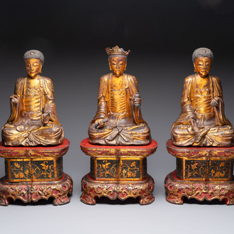 A set of three Chinese or Vietnamese gilt-lacquered wooden sculptures of Buddha, 18/19th C.