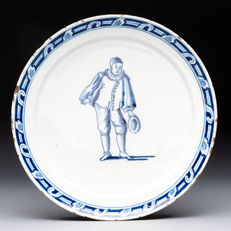 A rare blue and white Dutch Delft plate depicting Pierrot or a Commedia Dell'Arte figure, 18th C.