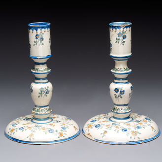 A pair of polychrome French faience candlesticks, 18th C.