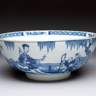 A Chinese blue and white punch bowl with a lady and two boys in a garden, Qianlong