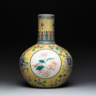 A large Chinese famille rose yellow-ground 'tianqiu ping' vase with flowers and antiquities, 19th C.
