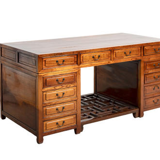 A Chinese wooden desk with drawers and a footrest, 19/20th C.