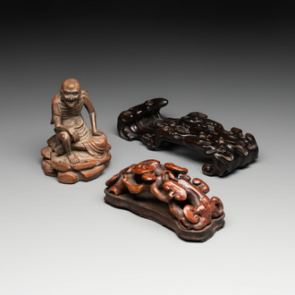 A Chinese bamboo figure of Luohan, a ruyi group on wooden stand and a hongmu stand, 19/20th C.