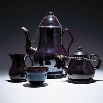 A black-glazed pottery coffeepot, teapot, milk jug and a bowl, Namur, 18th C.