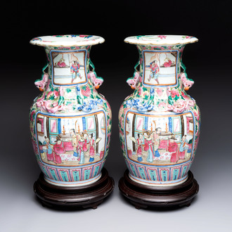A pair of Chinese famille rose vases with narrative design on wooden stands, 19th C.