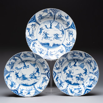 Three large Chinese blue and white 'hunting scene' deep dishes, Chenghua mark, Kangxi