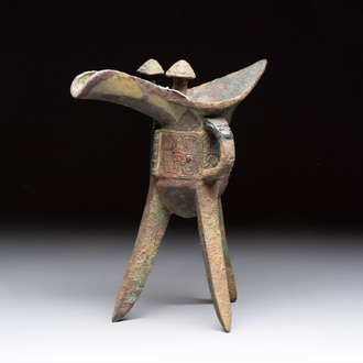 A Chinese archaic bronze wine vessel with taotie design, 'jue 爵', Zhou