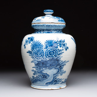A blue and white Dutch Delft vase and cover with floral design, early 18th C.