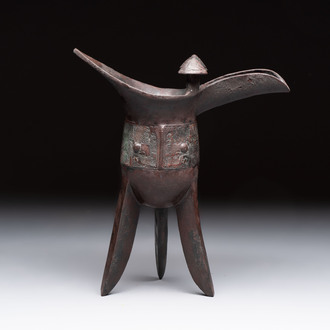 A Chinese archaic bronze wine vessel with taotie design, 'jue 爵', Zhou
