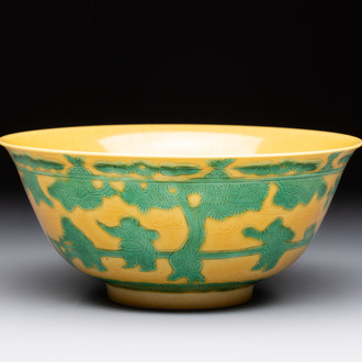 An imperial Chinese green-enamelled yellow-ground 'playing boys' bowl, Yongzheng mark and of the period